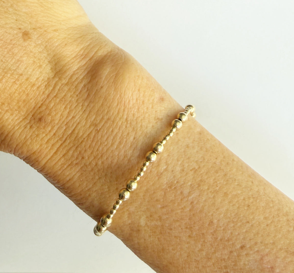 The Demi bracelet laid flat showing the full beaded pattern